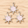 Detailed view of silver octagonal star charms with pink enamel and spiral metal pattern - 10 Pieces Pack / Silver Pink
