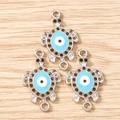 Detailed view of silver-plated sea turtle pendants with blue evil eye enamel and twin loops - 10 Pieces Pack / Silver Blue