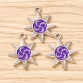 Detailed view of silver eight-pointed star pendants with purple enamel and spiral pattern - 10 Pieces Pack / Silver Purple
