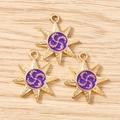 Macro detail of star-shaped golden alloy pendants with purple enamel for DIY jewelry - 10 Pieces Pack / Gold Purple