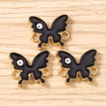 Three black butterfly charms with gold metal borders for DIY jewelry making and crafts - 10 Pieces Pack / Gold Black