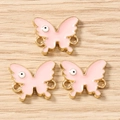 Pink enamel butterfly jewelry connectors with golden metal edges and eye pattern detail - 10 Pieces Pack / Gold Pink