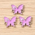 Macro view of purple enamel butterfly charms with eye detail for DIY jewelry making - 10 Pieces Pack / Silver Purple