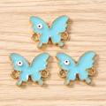Detail of light blue enamel butterfly charms with gold metal edges and double rings - 10 Pieces Pack / Gold Lake Blue