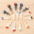Cartoon enamel skull charms with colorful bows for DIY jewelry and necklaces - 10 Pieces Pack / Multicolor