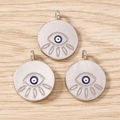 Macro shot of three evil eye enamel charms with eyelashes on light wood background - 10 Pieces Pack / Silver Pink