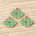 Macro detail of green enamel lip charms with gold alloy edges on light wood surface - 10 Pieces Pack / Lip