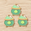 Three St. Patrick's Day green pot charms with gold clover detailing on wooden surface - 10 Pieces Pack / Pot of Gold