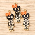 Three Halloween skull charms with orange bows in gold-plated alloy and enamel - 10 Pieces Pack / Gold Black Orange