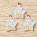 Détail macro de pendentifs flacons en émail avec nœuds roses pour bijoux DIY - Lot de 10 / Étoile bleue