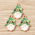 Macro detail of St Patrick's Day gnome enamel charms with green clover hats and gold base - 10 Pieces Pack / White Beard Santa