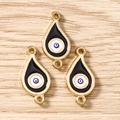 Detailansicht der Teardrop Evil Eye Verbinder mit goldenem Metallrahmen für DIY-Schmuck - 10 Stück/Packung / Goldschwarz