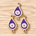 Detail von lila Evil Eye Anhängern mit Goldrand für die Schmuckherstellung - 10 Stück / Gold Lila
