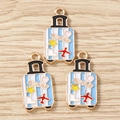 Détail de breloques valise bleues avec étoiles et avions pour bijoux DIY - Lot de 10 / Bagage