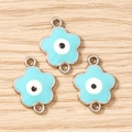 Τρία μπλε κοσμήματα evil eye σε σχήμα λουλουδιού με διπλούς κρίκους σε ξύλο - Ασημί Μπλε