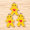 Close-up of three yellow gingerbread man enamel charms with red heart for DIY jewelry - 10 Pieces Pack / Yellow