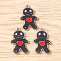 Detail of three black skeleton gingerbread man charms with red hearts on wood - 10 Pieces Pack / Black