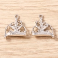 Macro view of silver fountain-shaped alloy charms with star details for DIY jewelry - 5 Pieces / Silver