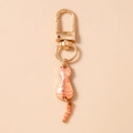 Detail of cute orange cat keychain showing the gold alloy finish and moving tail charm - Orange Cat