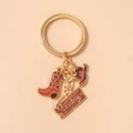 Détail d'un porte-clés de cowboy avec pendentifs émaillés en forme de botte et de chapeau - Style Motif Léopard(2037) / Marron