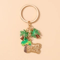 Detalle de llavero dorado tropical con palmeras y dije de Take Me To The Beach - Palmera