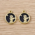 Detailed close-up of golden angel charms with black enamel finish for DIY jewelry - Gold Black Angel