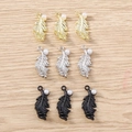 Detail showing feather-shaped DIY charms with pearls in gold, silver, and black finish - 5 Pieces / Multicolor