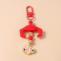 Detail of red claw machine keychain with metal carabiner and beaded cloud charm - Red