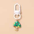 Detail of colorful spotted mushroom keychain with white snap hook and gold-plated finish - Green Mushroom