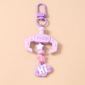 Detailed view of purple claw machine keychain with star beads and Hi cloud pendant - Purple