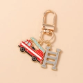 Detailed view of firefighter keychain with red fire truck and ladder charms in gold finish - Fire Truck and Ladder
