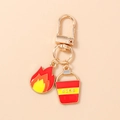 Detail of creative fire department keychain with red fire bucket and flame charms - Flame and Fire Bucket