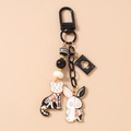 Detail of cartoon cat and rabbit charms with poker card on a black metal keychain - Black Theme Cat Rabbit