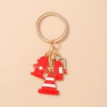Detailed view of red enamel fire hydrant, extinguisher and cone charms on golden keychain - Extinguisher Hydrant Traffic Cone