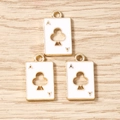 Detailed close-up of three gold-plated enamel Ace of Clubs poker card charms on wood - 10 Pieces Pack / White