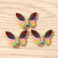 Detail shot of colorful butterfly enamel charms for DIY jewelry and accessory making - Colorful