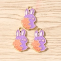 Detailed macro view of purple rabbit enamel charms for DIY jewelry and keychain making - Purple