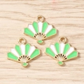 Detailed macro view of three fan-shaped enamel charms with green and white finish - 10 Pieces Pack / Green and White