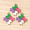 Close-up of four-color puzzle heart charms in purple green pink and white with gold trim - 10 Pieces Pack / Purple Pink Geometric Puzzle