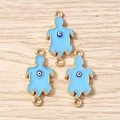 Detailed view of three gold sea turtle charms with blue enamel and evil eye center - 10 Pieces Pack / Blue