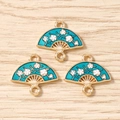 Detail of three blue enamel folding fan pendants with plum blossom patterns for DIY jewelry - 10 Pieces Pack / Teal