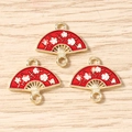 Detail of red fan-shaped enamel charms with white plum blossoms for DIY jewelry making - 10 Pieces Pack / Red