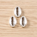 Detail view of shell-shaped silver alloy charms for DIY jewelry making and necklaces - 20 Pieces Set / Silver