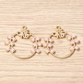 Detailed close-up of golden Fu character pendants with pink enamel for DIY jewelry making - 10 Pieces Pack / Round Pink Blessing Firecracker