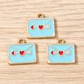 Detailed view of light blue envelope charms with red heart arrows on a wooden background - 10 Pieces Pack / Sky Blue