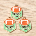Detail of green and orange shield-shaped football team enamel pendants on wood background - 10 Pieces Pack / FOOT Football Team