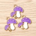 Dettaglio dei ciondoli a fungo in smalto viola con pois dorati per gioielli fai-da-te - Forma a doppio fungo / Confezione da 10 / Viola