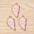 Detail of pink enamel half heart pendants with rhinestones and Best Friend engraving - Pink
