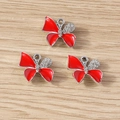 Detailed view of red enamel butterfly charms with sparkling rhinestones for DIY jewelry - 10 Pieces Pack / Silver Red