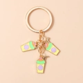 Detail of golden keychain with three colorful enamel summer drink cup pendants - Yellow Green Milk Tea